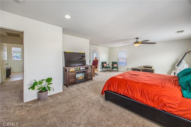 carpeted bedroom with recessed lighting, a ceiling fan, visible vents, and baseboards