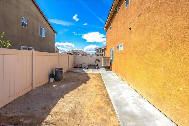 view of yard with a patio and a fenced backyard