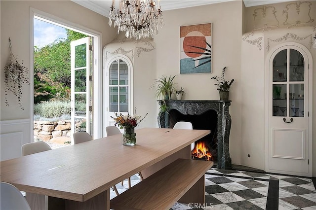 dining room featuring a notable chandelier and crown molding