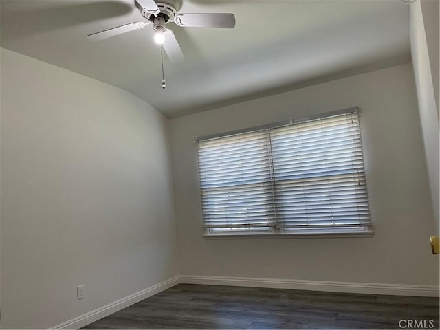 unfurnished room with a ceiling fan, lofted ceiling, baseboards, and wood finished floors