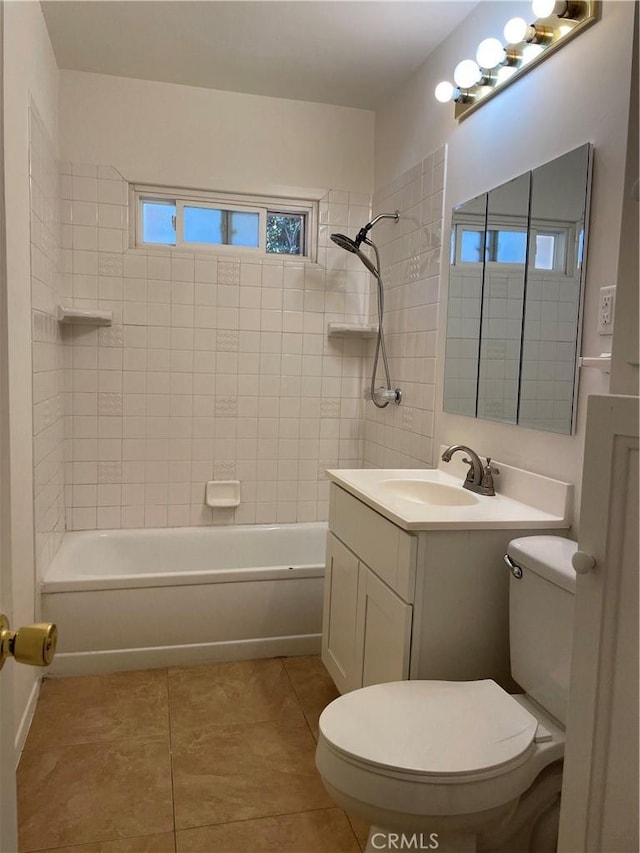 full bathroom featuring washtub / shower combination, vanity, toilet, and tile patterned floors