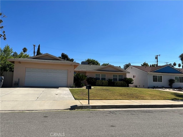 single story home featuring a garage, concrete driveway, a front lawn, and stucco siding