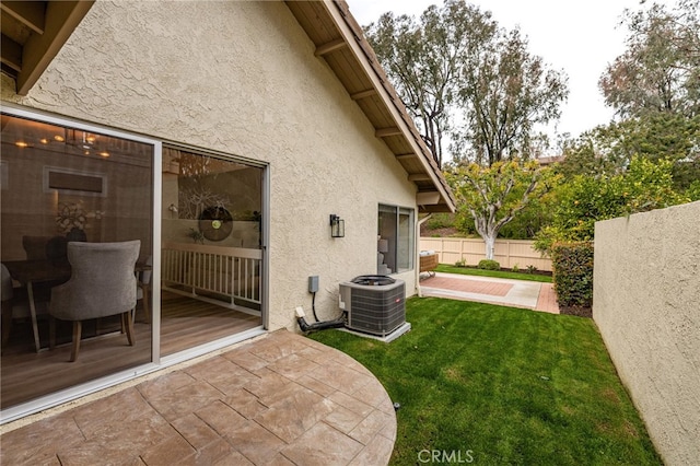 view of yard with a patio, cooling unit, and fence