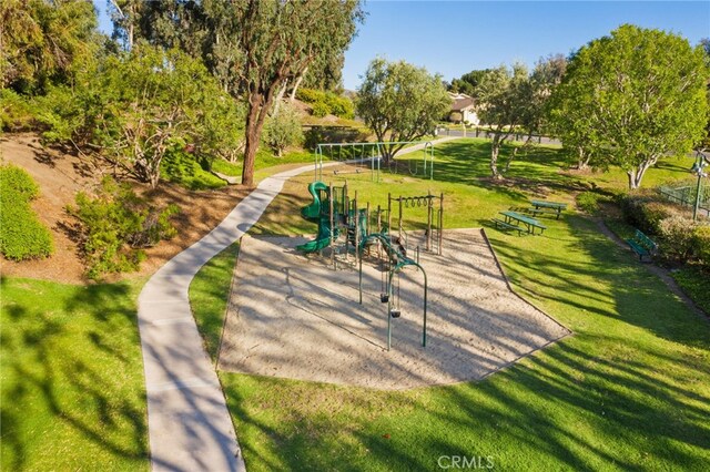 view of community with playground community and a lawn