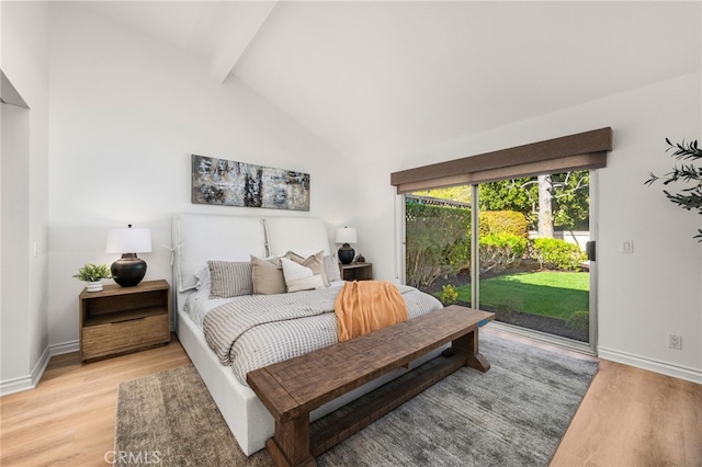 bedroom featuring baseboards, light wood-style floors, and access to exterior