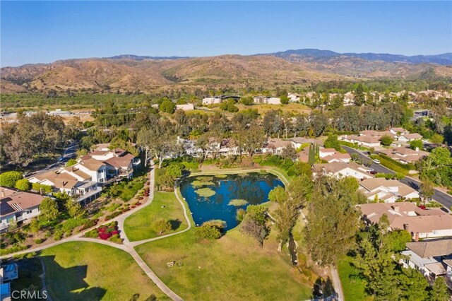 birds eye view of property with a residential view and a water and mountain view