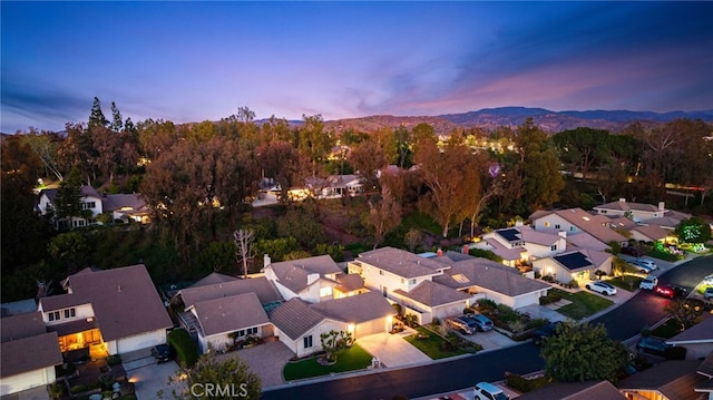 drone / aerial view with a mountain view and a residential view