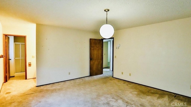 unfurnished room with light colored carpet