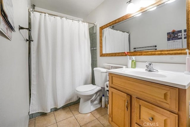 bathroom featuring vanity, a shower with shower curtain, tile patterned flooring, and toilet