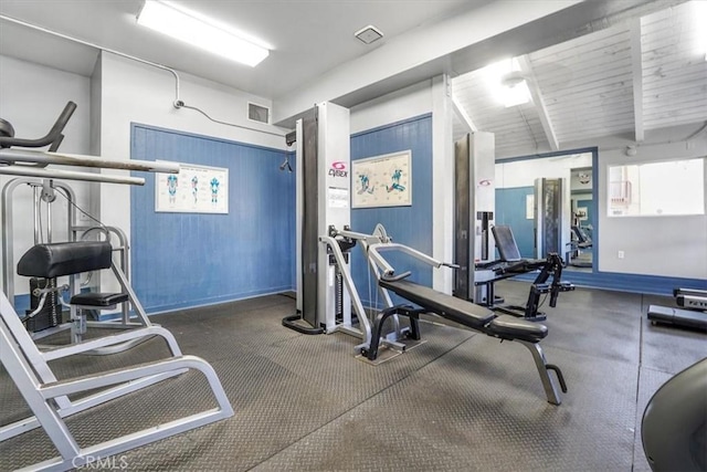 gym featuring baseboards