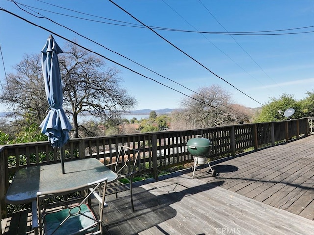 wooden deck with outdoor dining area