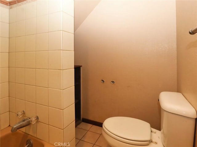 full bath with tile patterned flooring, toilet, and baseboards