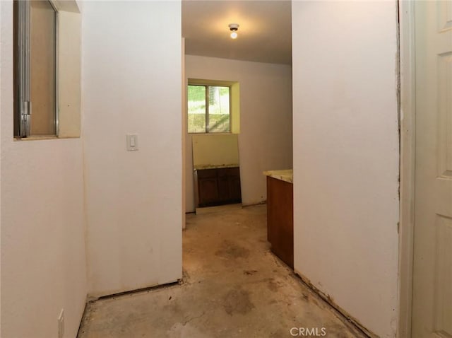 corridor with concrete flooring