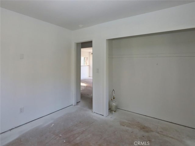 unfurnished bedroom featuring a closet