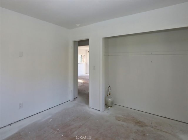 4165 Dawes Ave, Nice, CA 95464 - unfurnished bedroom with concrete flooring and a closet
