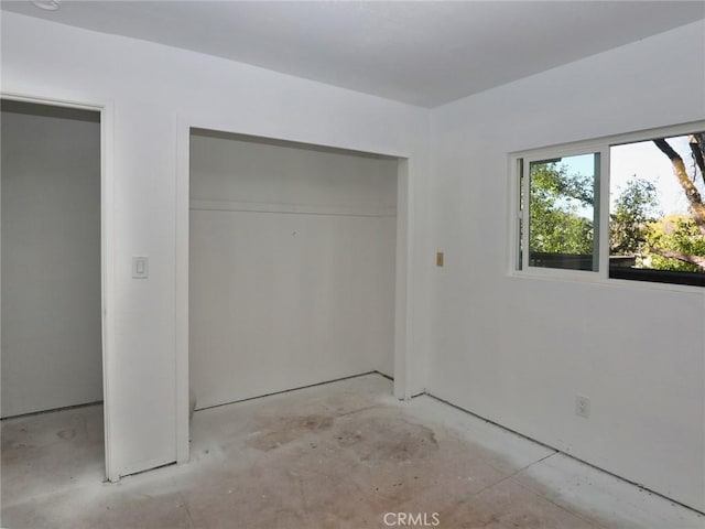 unfurnished bedroom with a closet