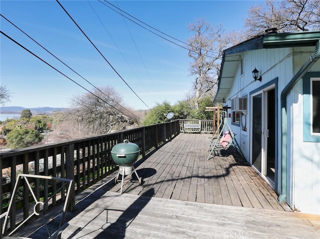 wooden terrace with area for grilling