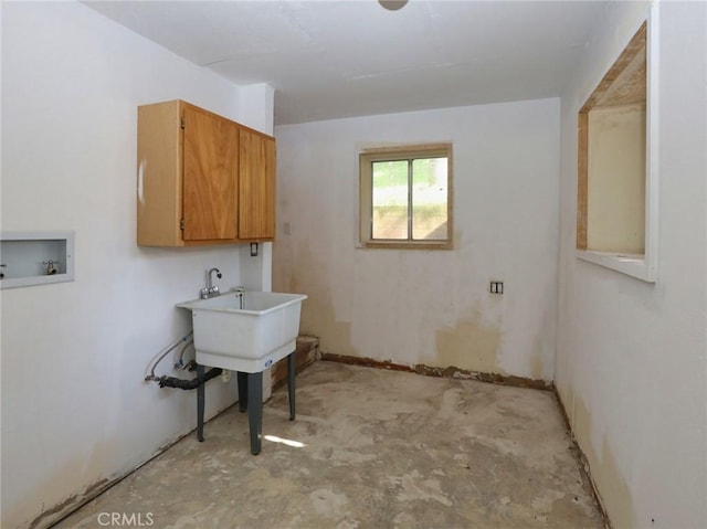 washroom with cabinet space and hookup for a washing machine