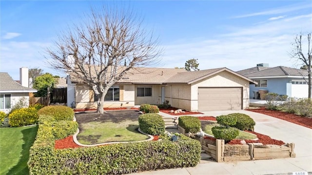 single story home with a garage, driveway, fence, and stucco siding