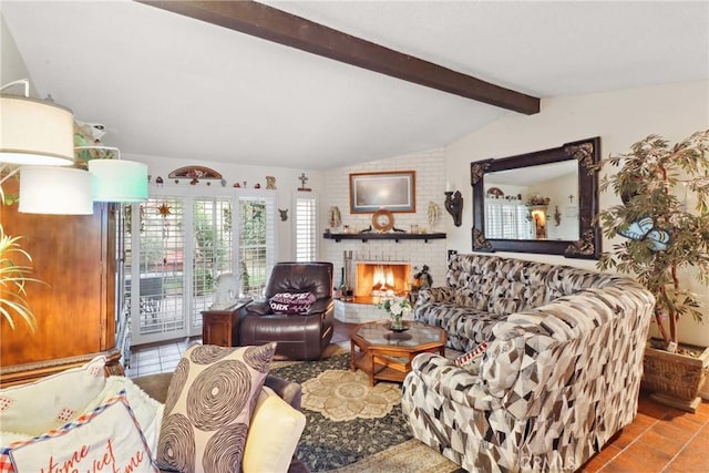 living area with a fireplace, lofted ceiling with beams, and tile patterned floors