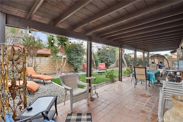 view of patio / terrace with a fenced backyard and outdoor dining area