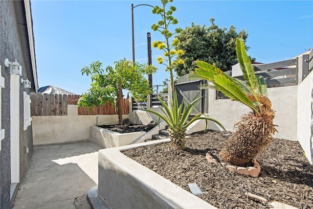 exterior space featuring fence and a patio