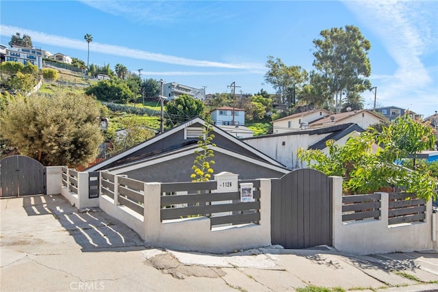 view of front of home featuring a fenced front yard and a gate