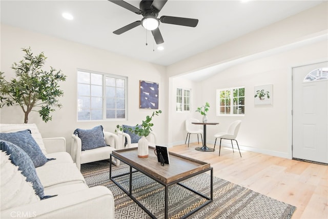 living room with light wood-style flooring, baseboards, ceiling fan, and recessed lighting