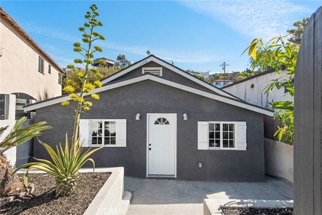 view of front facade featuring a patio area and stucco siding