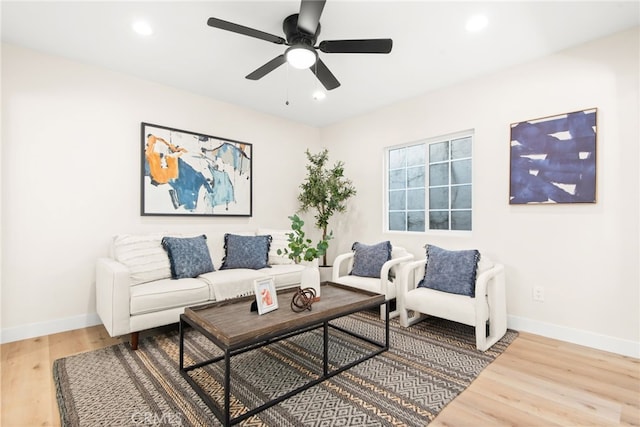 living room with recessed lighting, ceiling fan, baseboards, and wood finished floors