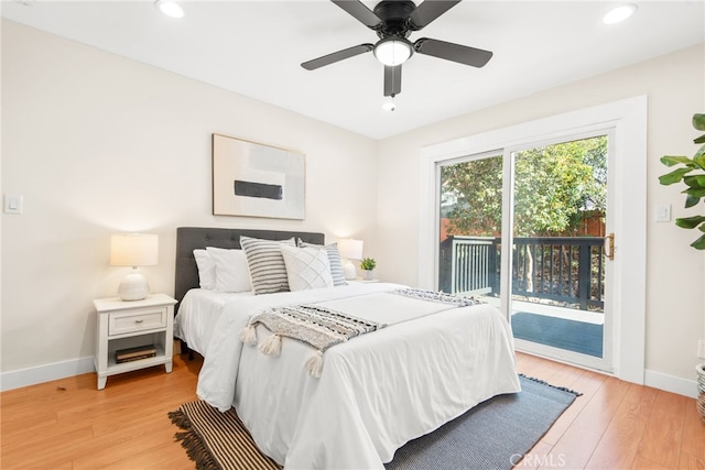 bedroom with access to outside, recessed lighting, light wood-style flooring, and baseboards