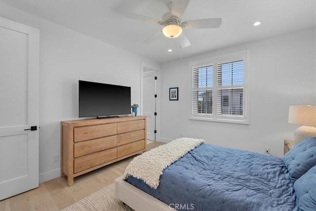 bedroom featuring recessed lighting, baseboards, wood finished floors, and ceiling fan