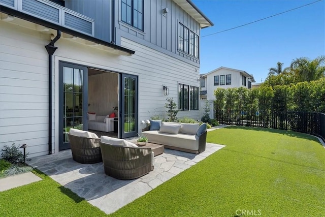 view of patio featuring an outdoor hangout area and fence