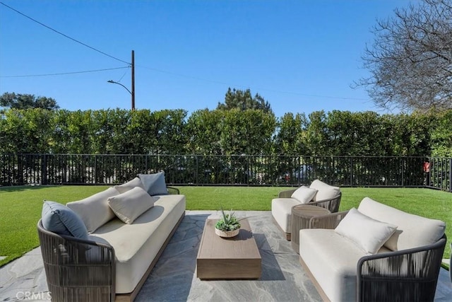 view of patio / terrace featuring an outdoor living space and a fenced backyard