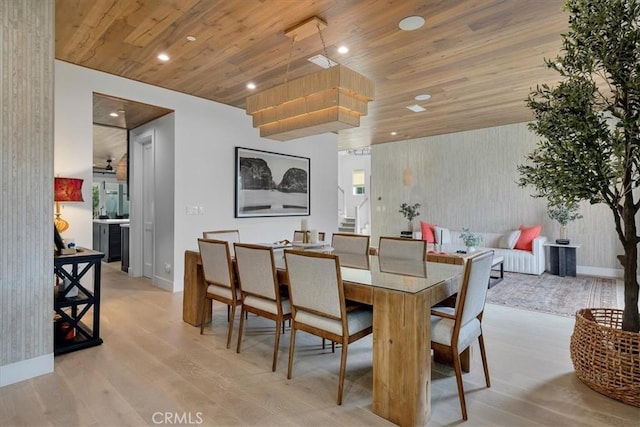 dining room featuring recessed lighting, light wood-style flooring, wood ceiling, and baseboards