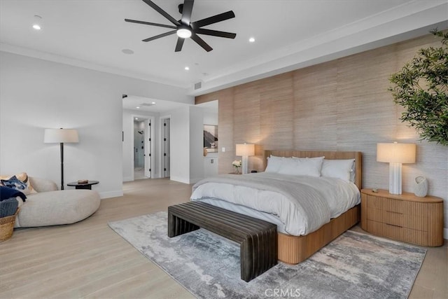 bedroom with recessed lighting, crown molding, baseboards, and wood finished floors