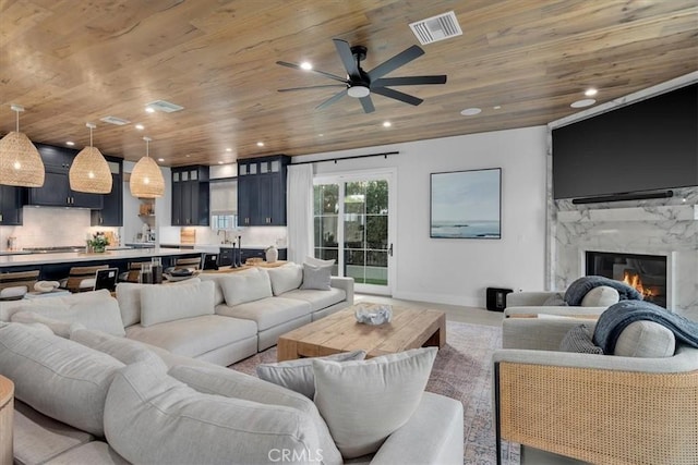 living room with visible vents, recessed lighting, wood ceiling, and a ceiling fan