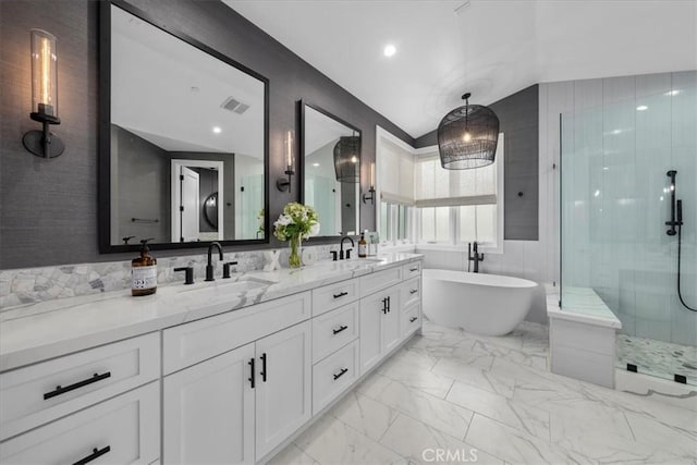 bathroom featuring a sink, visible vents, marble finish floor, and an enclosed shower