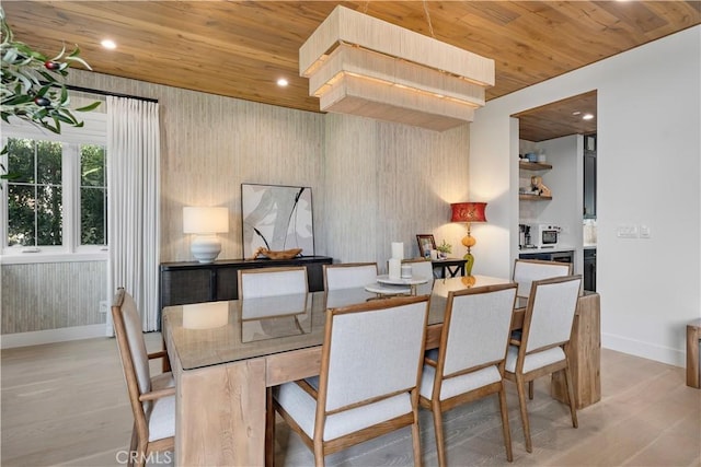 dining area with recessed lighting, light wood-style flooring, and wooden ceiling