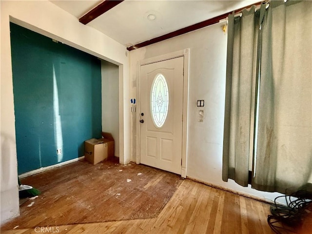 foyer entrance featuring wood finished floors