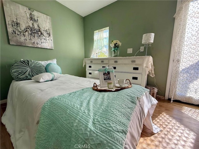 bedroom with wood finished floors