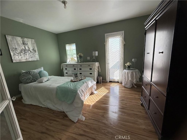 bedroom featuring wood finished floors