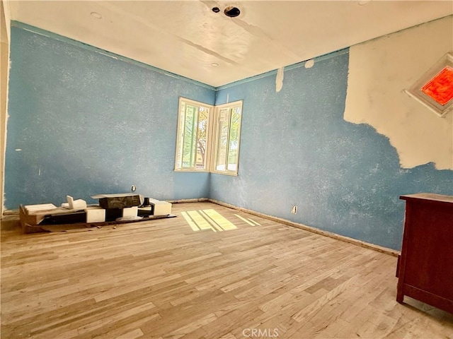 unfurnished room featuring wood finished floors