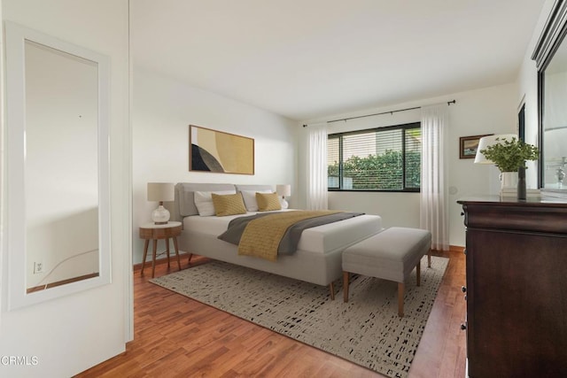 bedroom featuring wood finished floors