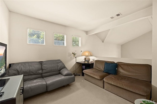 living room featuring vaulted ceiling with beams, carpet, and visible vents