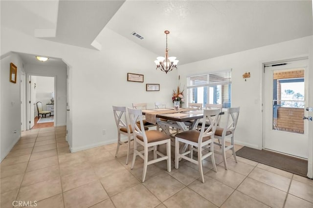 dining room with lofted ceiling, visible vents, an inviting chandelier, and light tile patterned floors