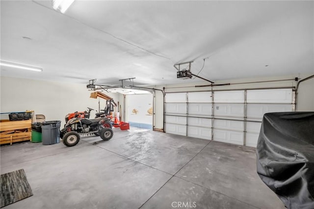 garage featuring a garage door opener