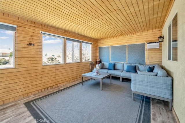 sunroom / solarium featuring wood ceiling