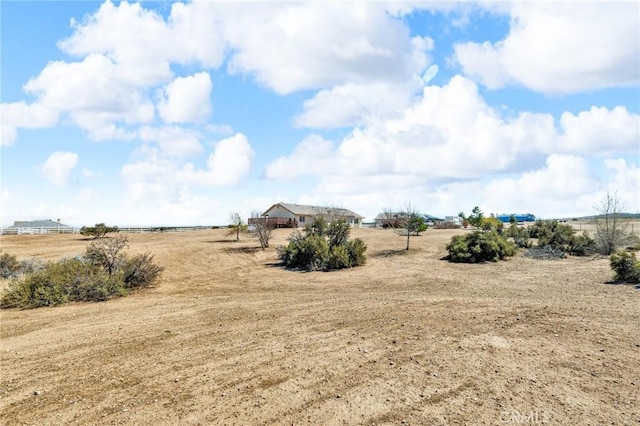 view of yard with a rural view