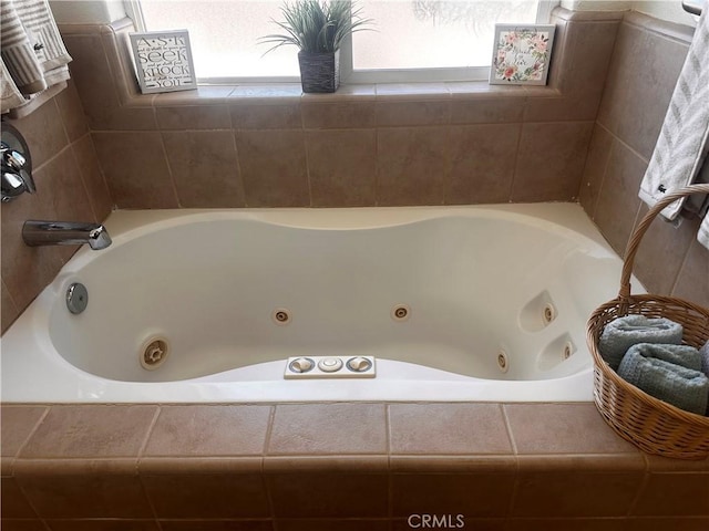 full bath featuring a tub with jets